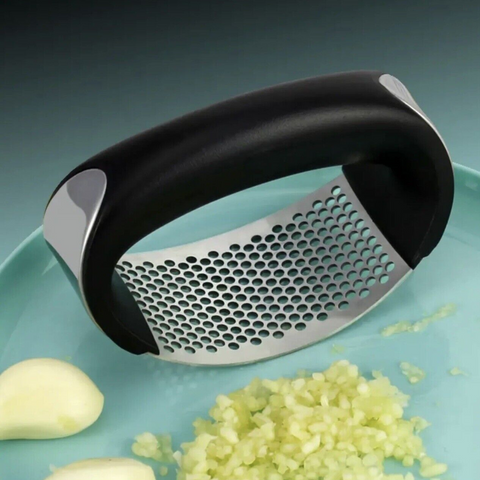 Introducing the Manual Stainless Steel Garlic Press: Simplify garlic mincing.