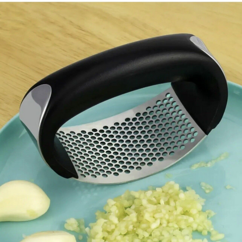 Introducing the Manual Stainless Steel Garlic Press: Simplify garlic mincing.